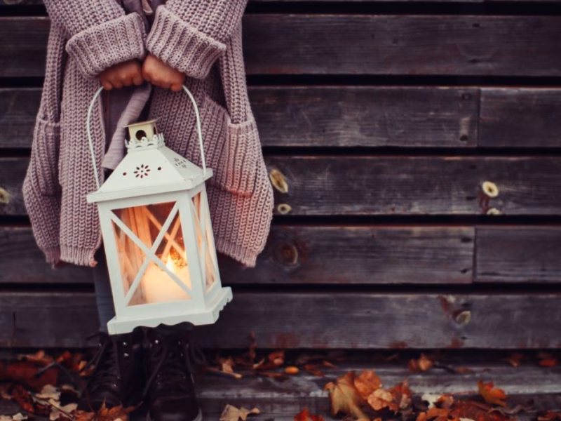 Heating Maintenance Time - girl in sweater holding lantern