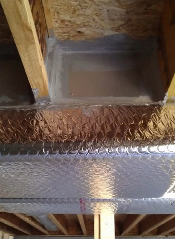 An air duct leak in a basement that has been repaired by Fitch Services in Charlottesville Virginia