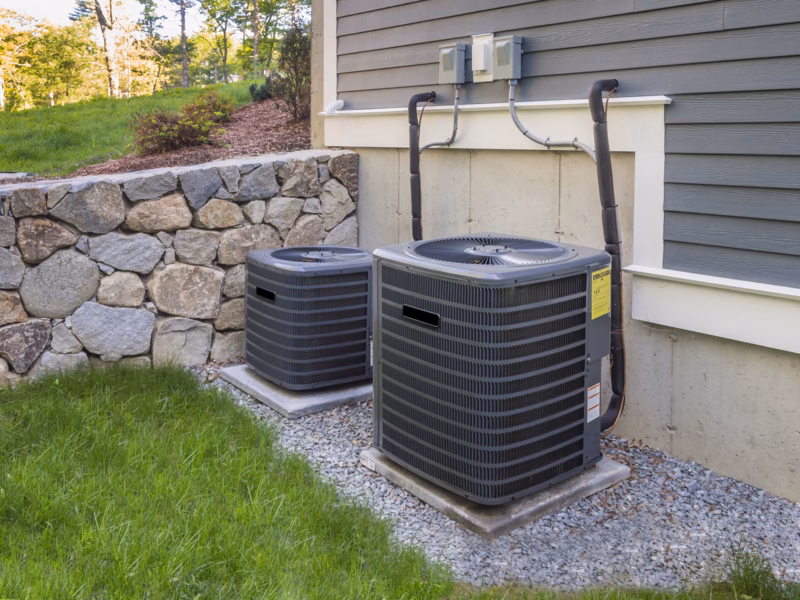 Two outdoor air conditioning units that need a tune-up, in Charlottesville Virginia