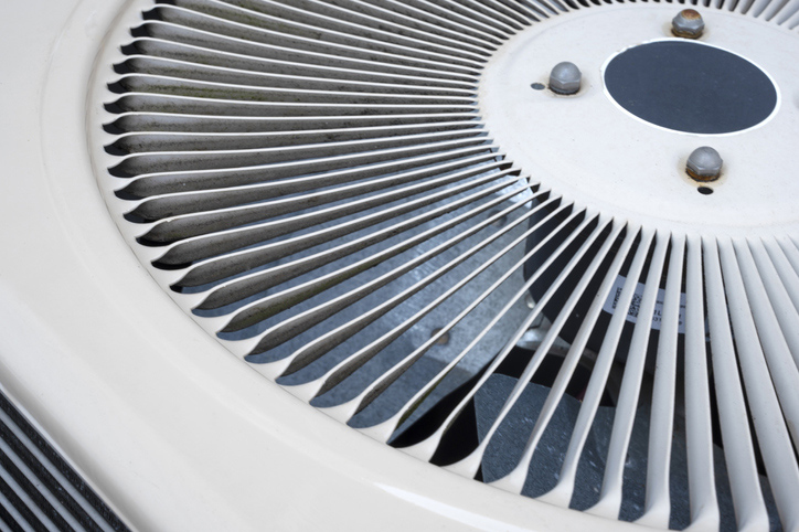 A close-up view of an air conditioning unit in Charlottesville Virginia. Extend the life of your HVAC system