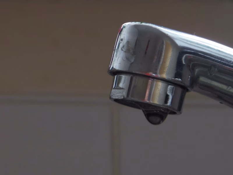 Faucet dripping in home requiring a plumber call to fix.
