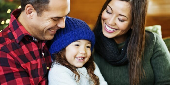 Happy family with mother, father and daughter in Charlottesville home made safe for winter.